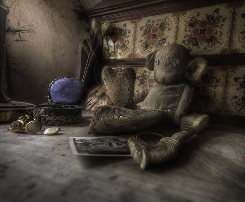 Rooms full of old toys and decay at abandoned manor house